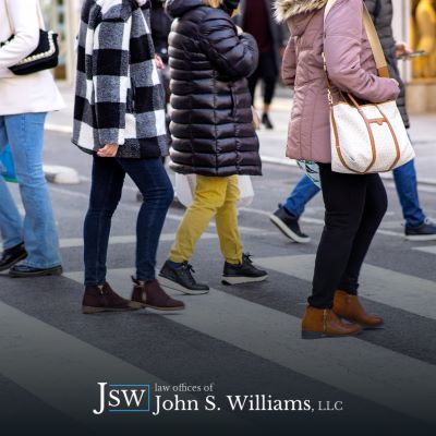 Pedestrians crossing a busy street in Louisiana