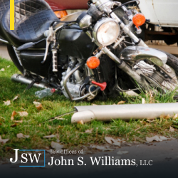 Damaged motorcycle on ground after motorcycle accident