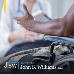 Personal injury victim sitting down while speaking with doctor